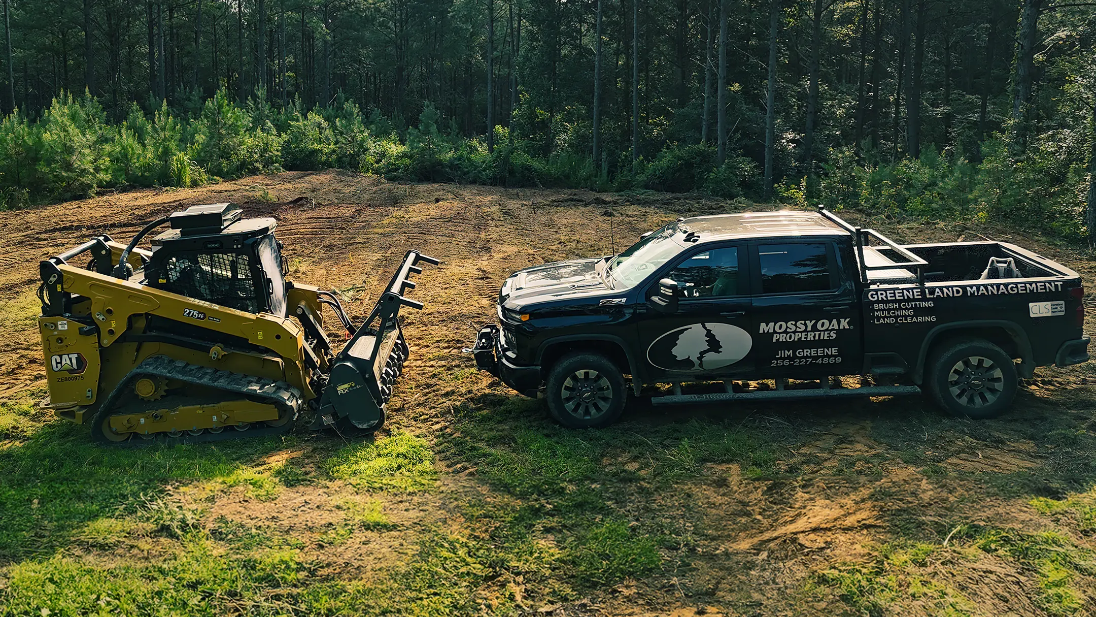 Mossy Oak Properties Truck and Caterpillar 275XE Skid Steer with mulcher